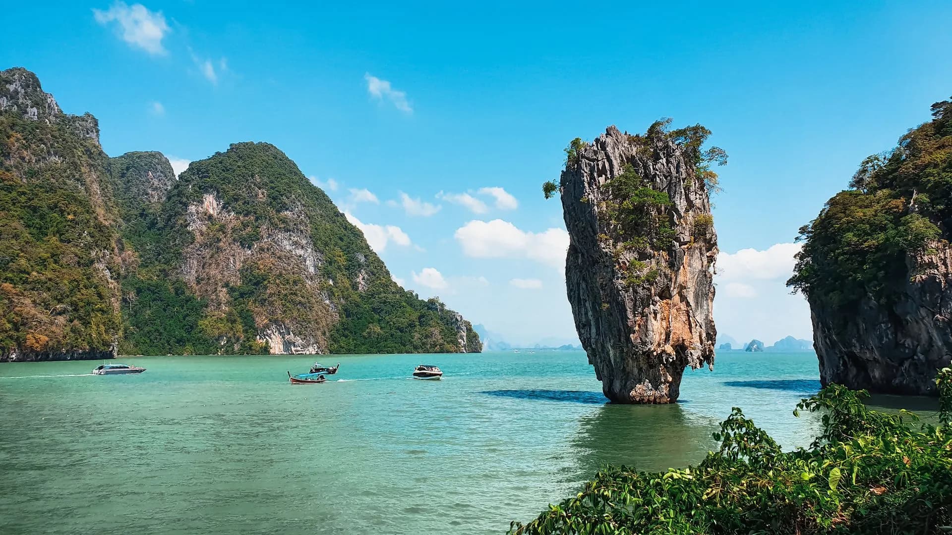 Ko Tapu limestone pinnacle rising from green water beside Khao Phing Kan in Phang Nga Bay